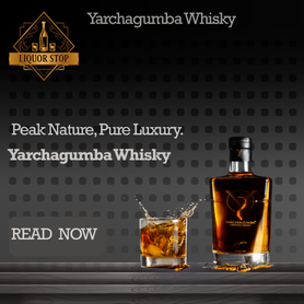 A luxury whisky bottle and a filled glass with a splash of amber liquid set on a dark wooden surface. The background is dark gray with a subtle dot pattern. Gold "Liquor Stop" logo in the top left and "Yarchagumba Whisky" branding throughout.